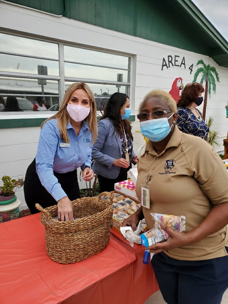 FUTURES Board Member Michelle Lee hands out Duke Energy hand sanitizers