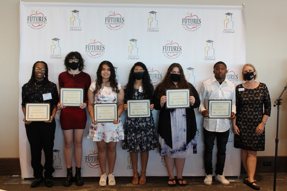 Photo 2: TSIC Volusia graduating seniors from East Volusia high schools, left to right: Keiarre Davenport, Mainland High School; Masie Evans-Lichtigfeld, New Smyrna Beach High School; Olivia Raymond and Veronia Sadek, Spruce Creek High School; Justice Thompson, Atlantic High School; Evan Williams, Mainland High School; and TSIC College Success Coash Carol Grogg. Not pictured are Vintorya Mills, Atlantic High School, and Caiden Patton, Seabreeze High School.